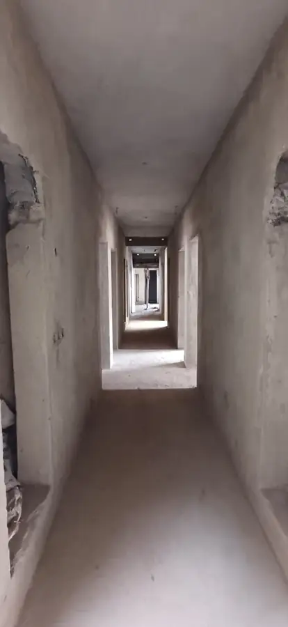 Plastered corridor ready for finishes
