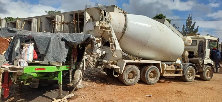 Concrete pump and mixer on site