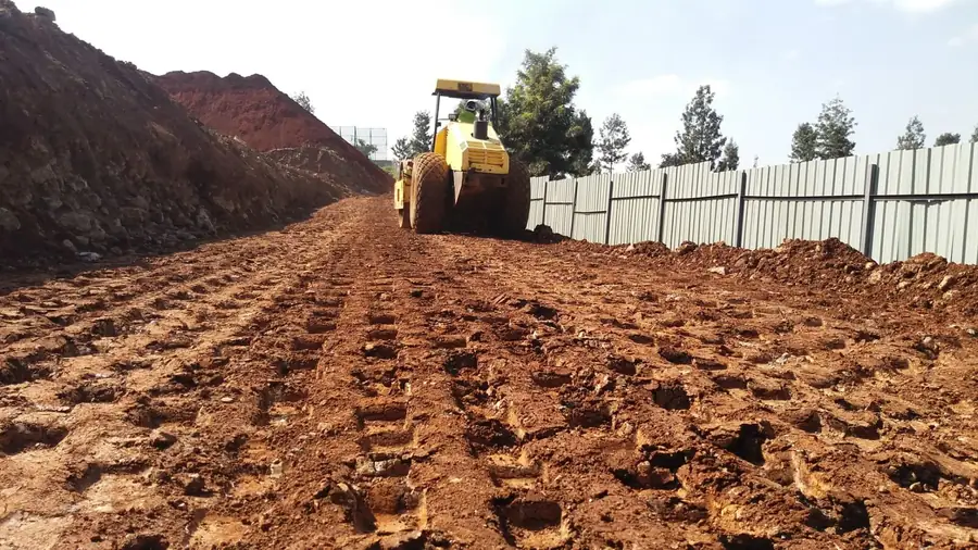 Cut-and-fill compaction with a roller