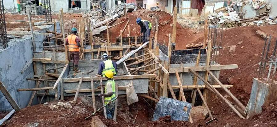 Crew installing formwork in the basement