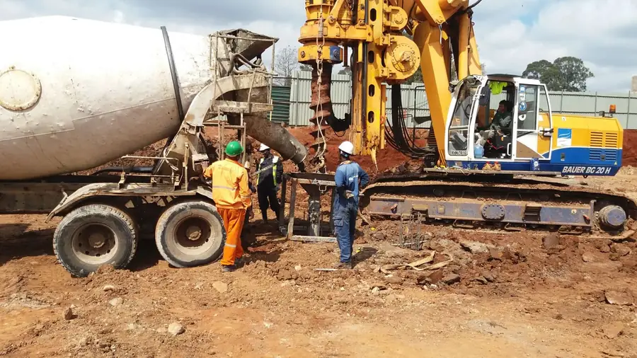Bored piling rig with concrete mixer