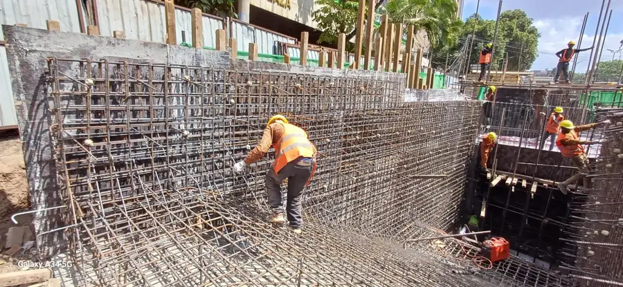 Steel fixer at work on basement walls
